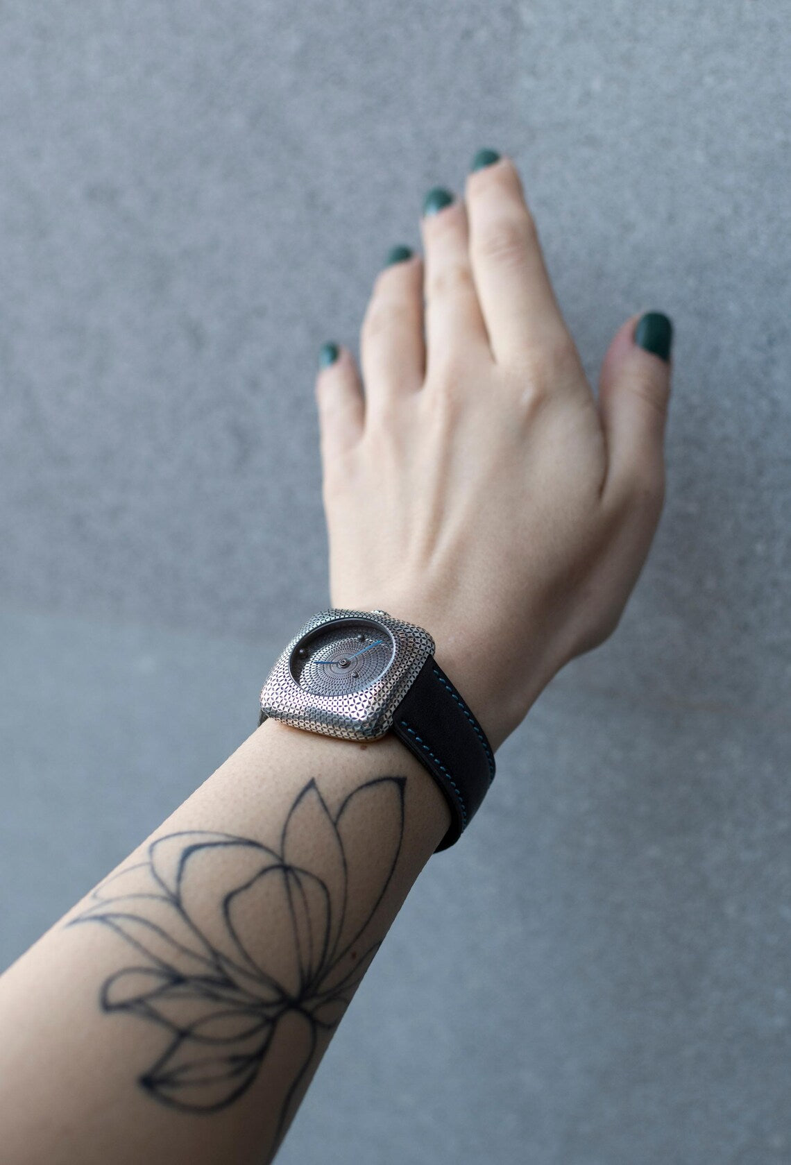 Modern minimalist silver watch with geometric dial design