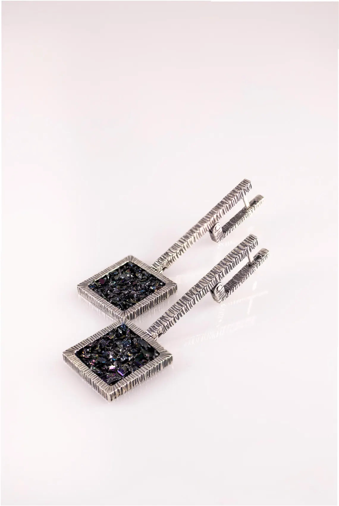 Modern sterling silver statement earrings with rainbow carborundum stones