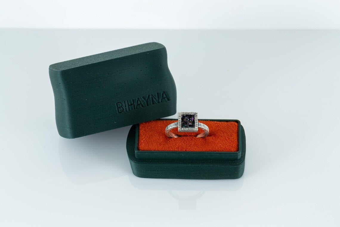 Ring in a green jewelry box with 'BIHAYNA' branding on a white background