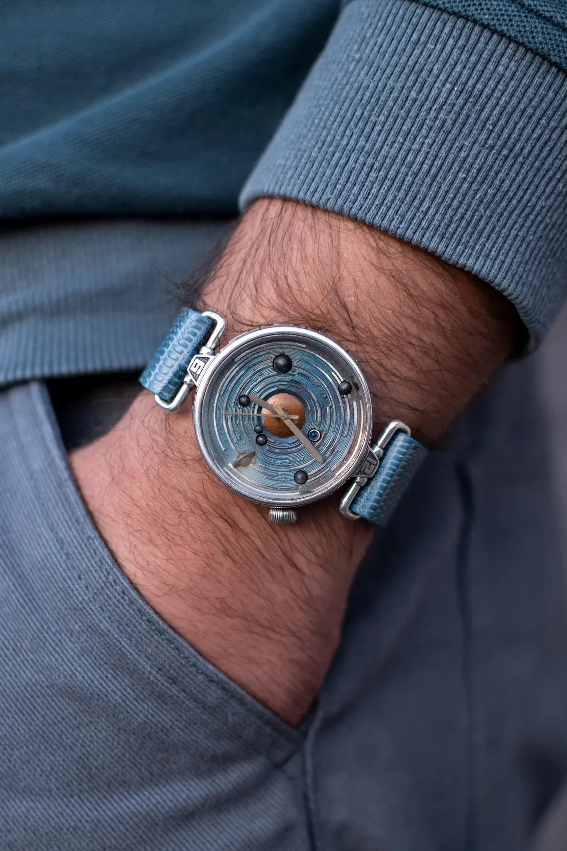 Artisan space-inspired wristwatch with planetary design