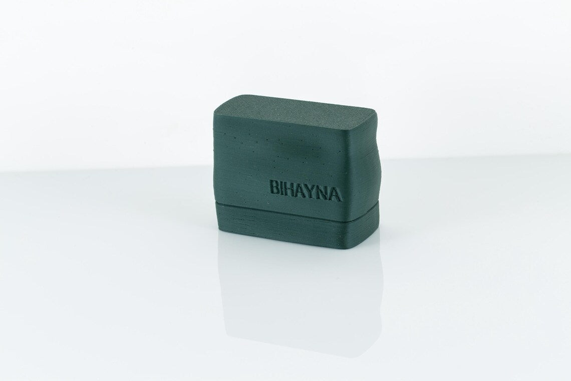 Green rectangular object with 'BIHAYNA' branding on a white background
