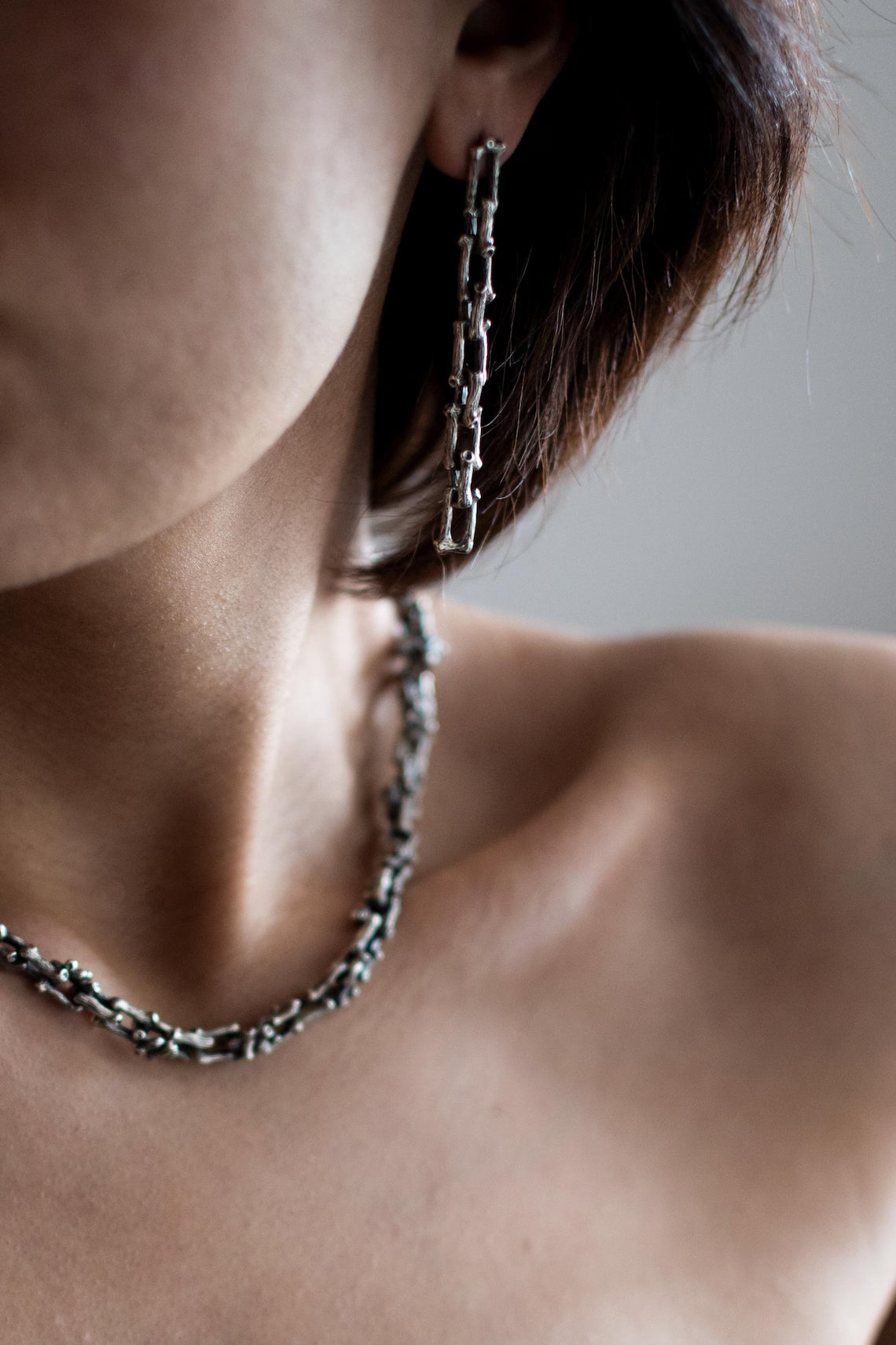 Unisex twig-inspired silver necklace with rustic finish