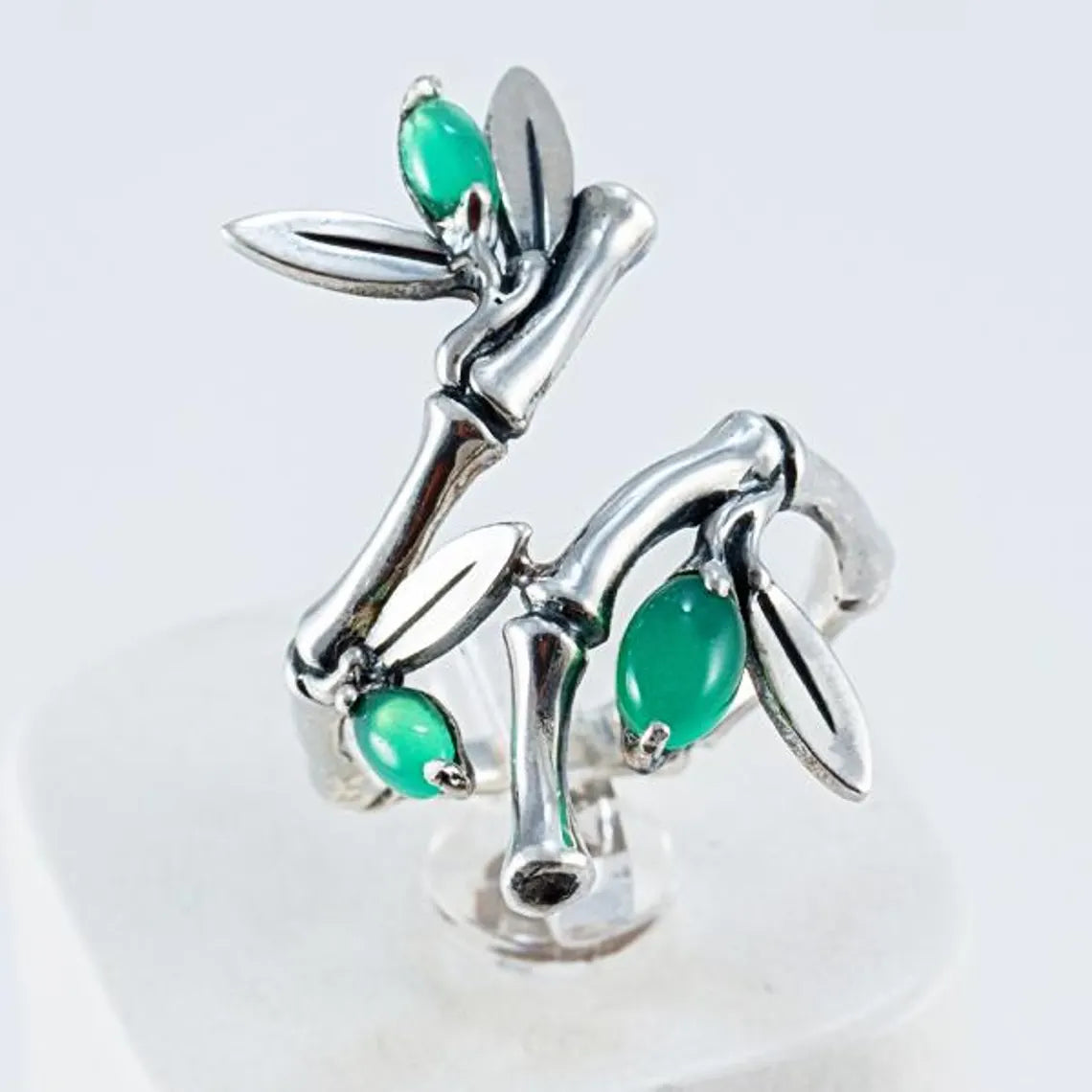 Bamboo ear climber in sterling silver with green stone