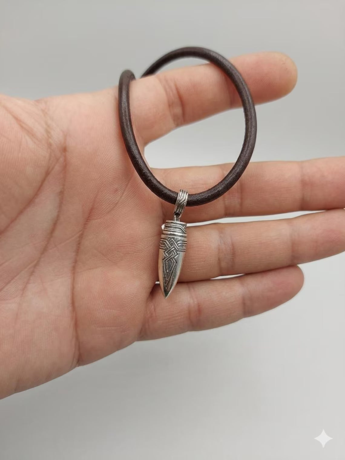Bullet pendant with leather cord