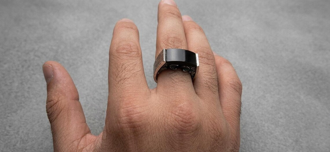 Aries zodiac ring featuring detailed ram heads and Black Onyx