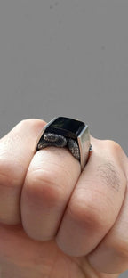 Unique coiled snake ring with gemstone centerpiece