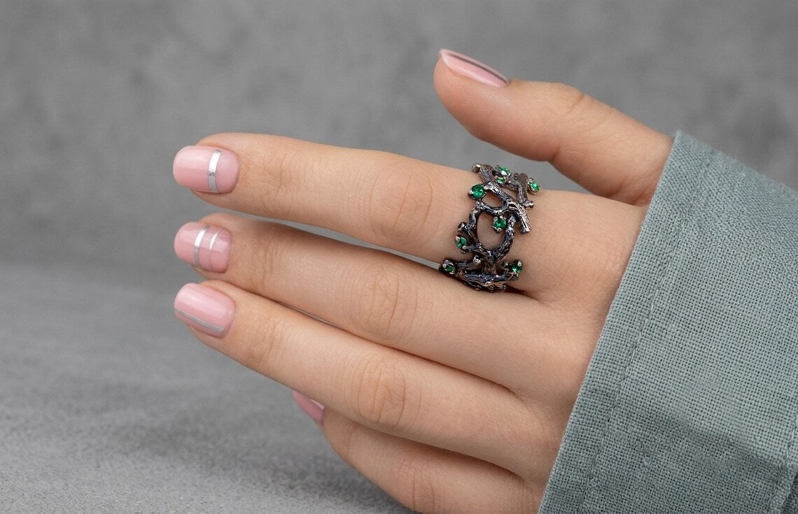 Handmade twig ring with green crystal accents