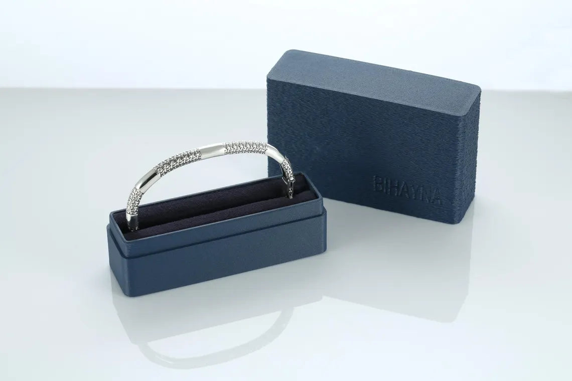 Silver ring in a blue box on a white background