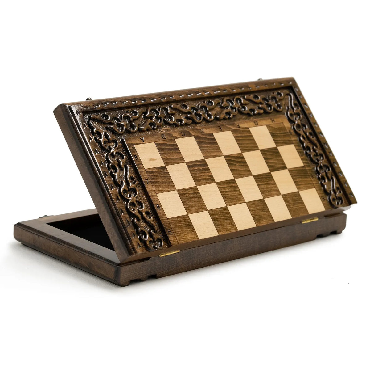 Carved wooden chess set displayed open with pieces in play