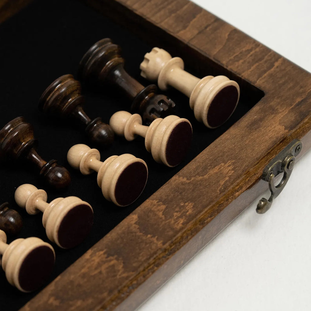 Carved wooden chess set folded, showing the ornament cover