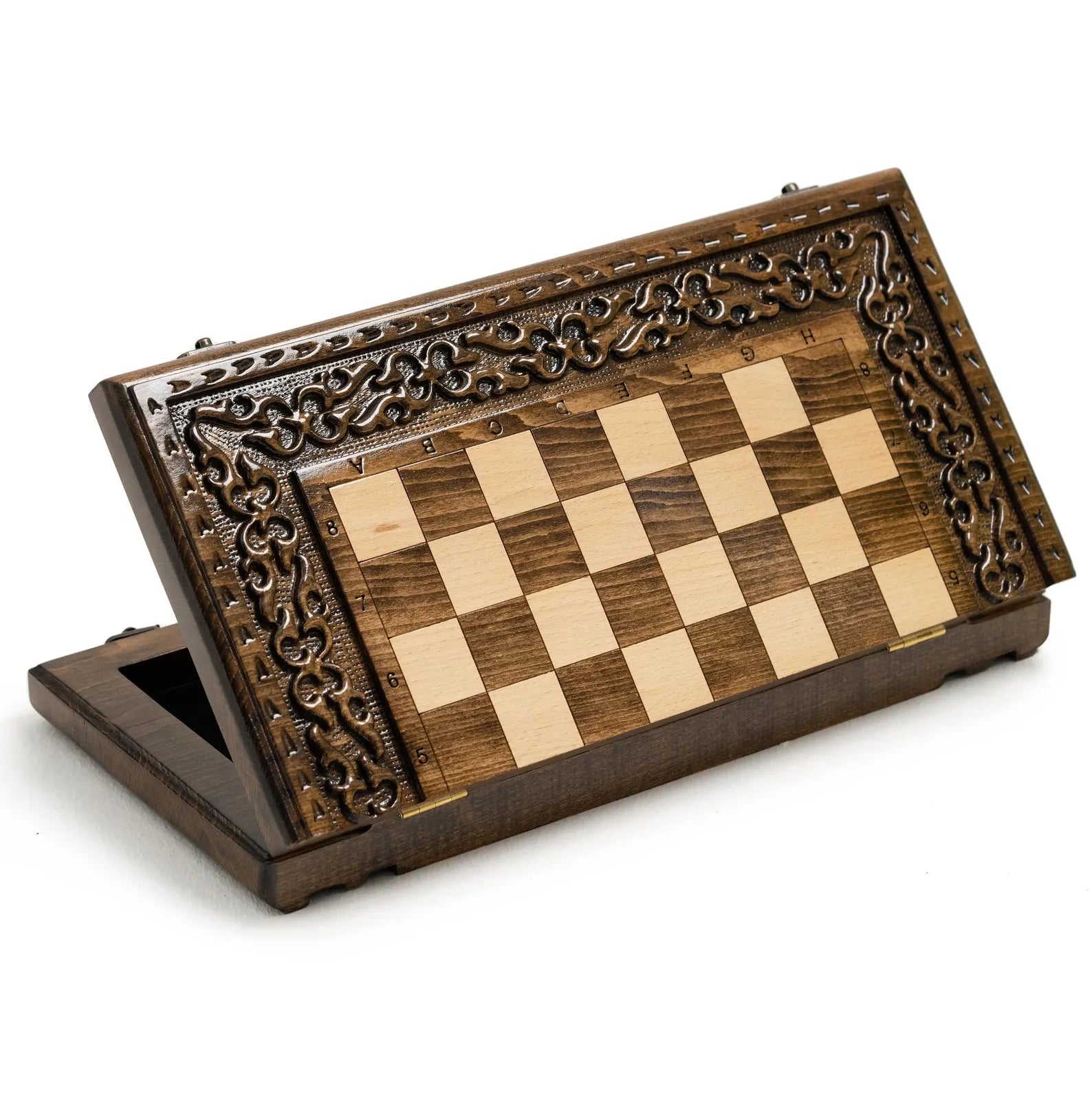 Light and dark hand-carved chess pieces lined up