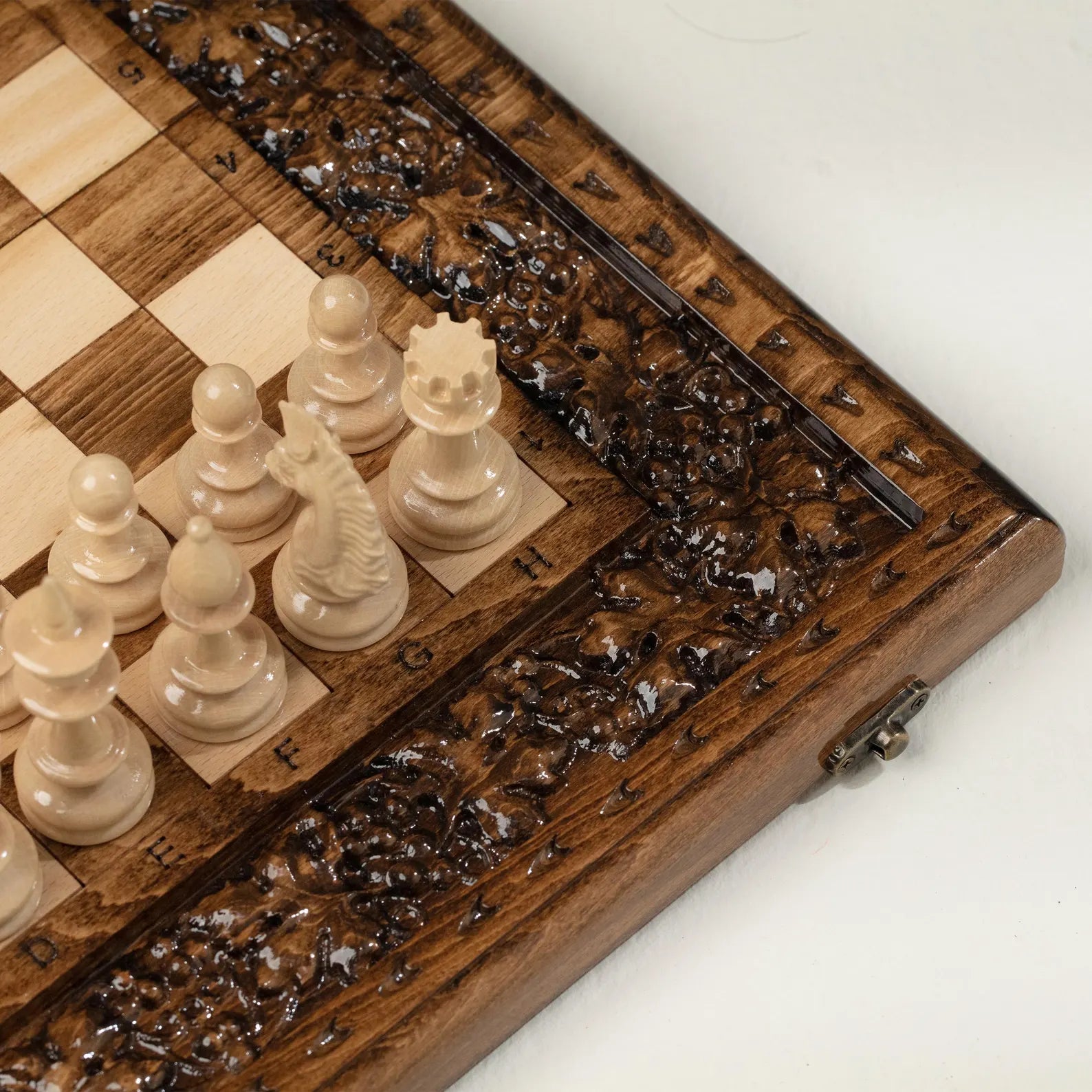 Close-up of the grapevine carving on the chessboard