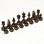 Light and dark carved chess pieces of the grapevine set