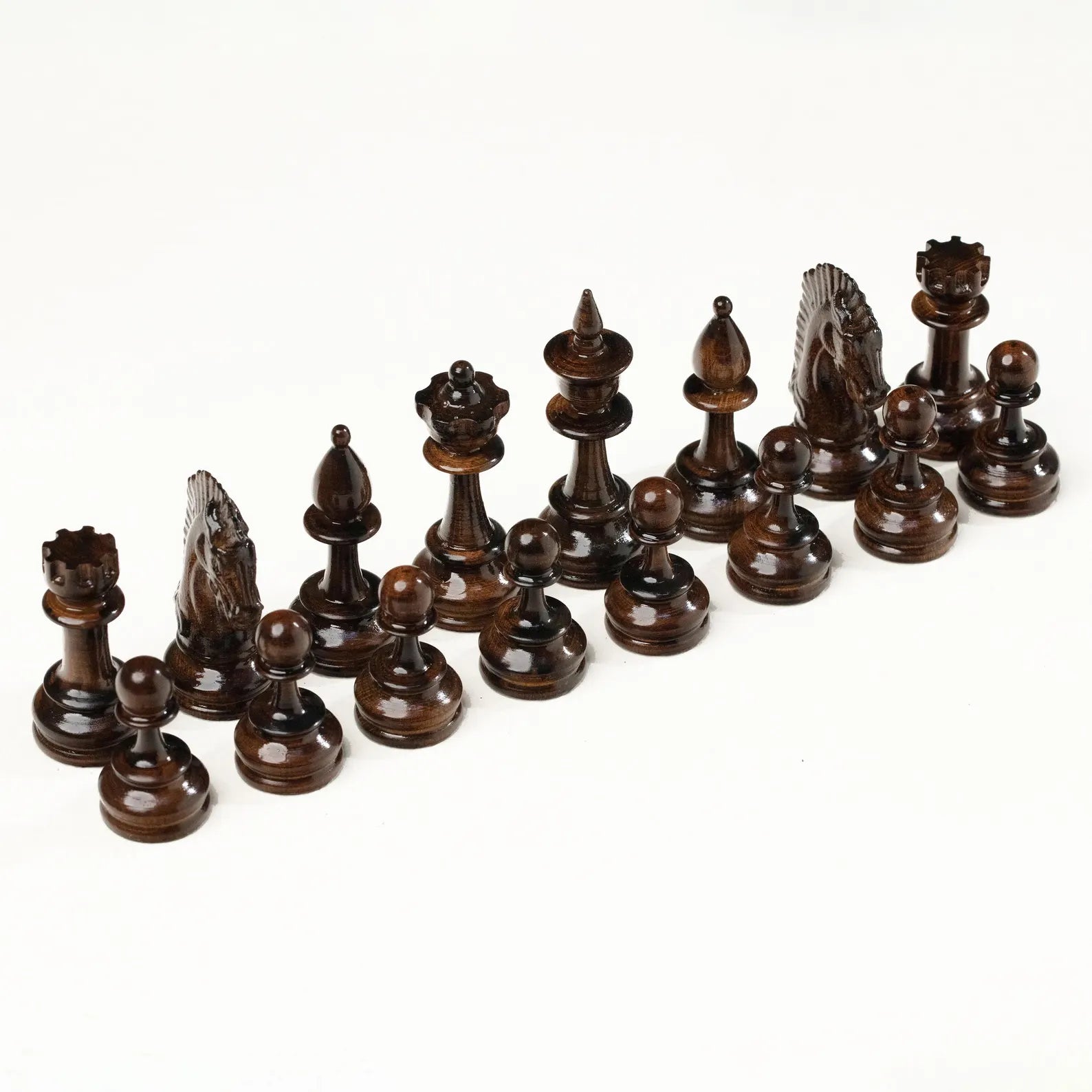 Light and dark carved chess pieces of the grapevine set