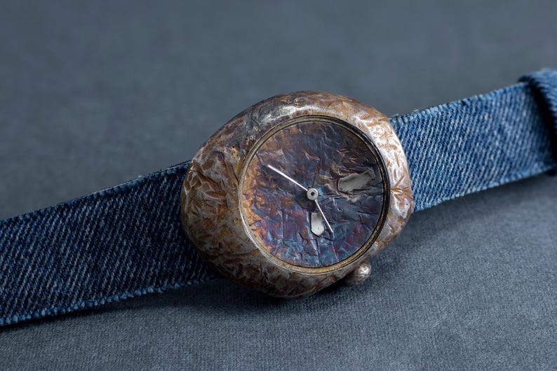 Hammered silver watch with iridescent dial and rugged finish