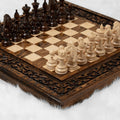 Carved wooden chess set with traditional ornament detailing