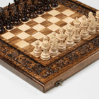 Carved wooden chess set with grapevine design