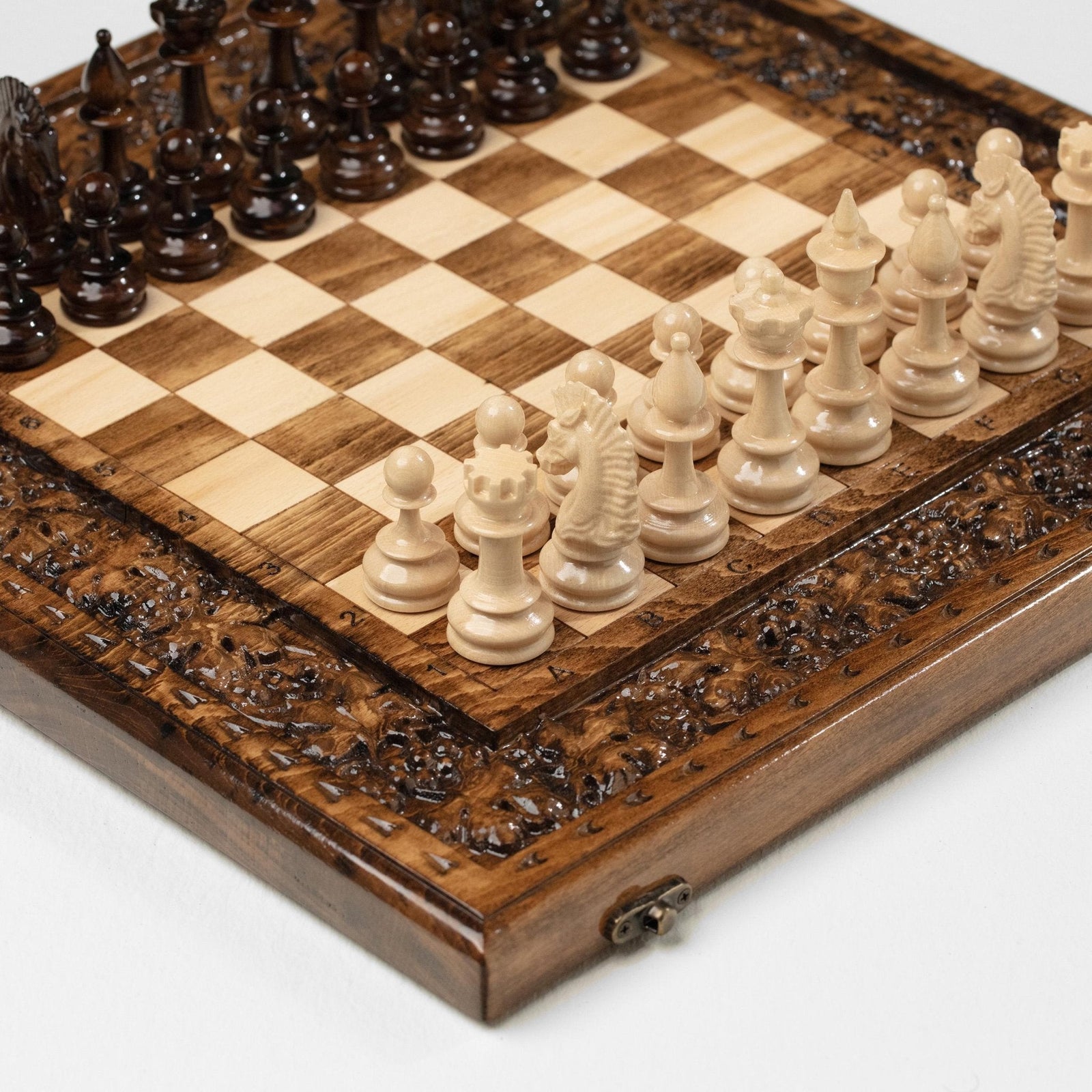 Carved wooden chess set with grapevine design
