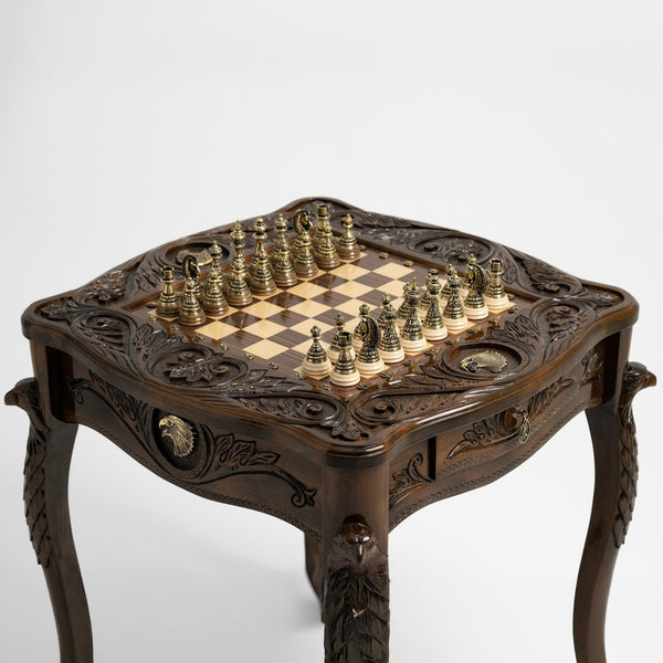 Luxury chess table with carved eagle design and brass pieces