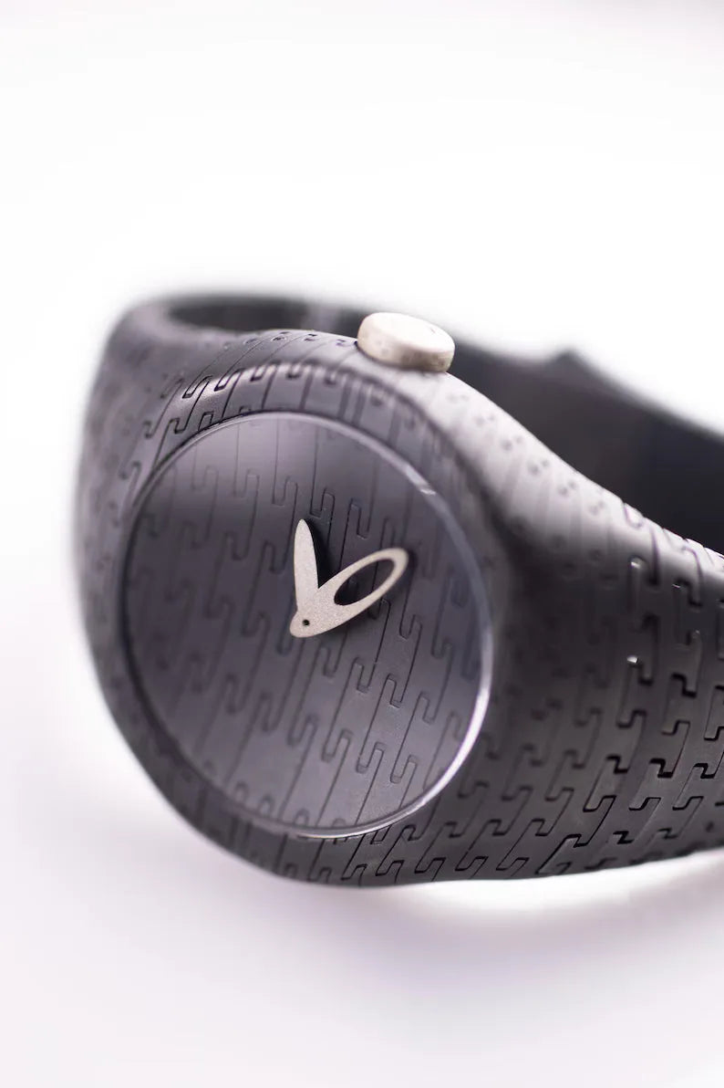 Minimalist silver watch with textured strap and sapphire crystal