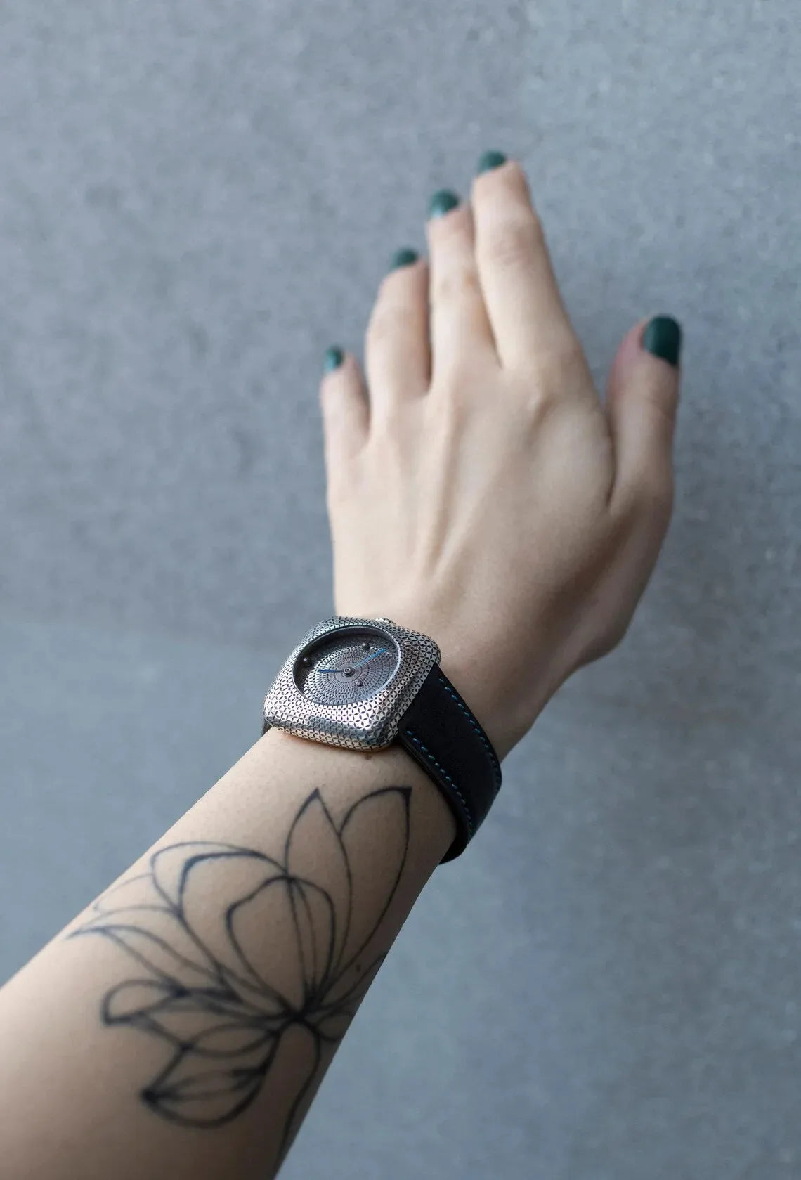 Modern minimalist silver watch with geometric dial design